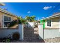 Charming patio area with seating and brick pavement at 1792 Winstan Ave, Englewood, FL 34223