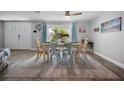 Dining room with table, chairs, and coastal decor at 1132 Piedmont Rd, Venice, FL 34293