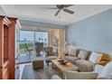 Spacious living room with water views and ample natural light at 13413 Gasparilla Rd # D203, Placida, FL 33946