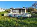 Unfinished pool area with concrete base and surrounding grass at 161 Danforth Dr, Punta Gorda, FL 33980