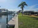 Private dock extending from backyard to the canal at 1933 Mississippi Ave, Englewood, FL 34224