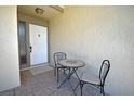 Front entry with small table and chairs, ideal for relaxing at 412 Cypress Forest Dr, Englewood, FL 34223