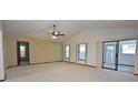 Spacious living room with high ceilings and lots of natural light at 412 Cypress Forest Dr, Englewood, FL 34223