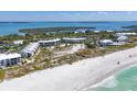 Aerial view of beachfront community with resort-style amenities at 5000 Gasparilla Rd # Dc102, Boca Grande, FL 33921