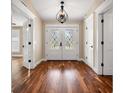 Elegant entryway with hardwood floors and double doors at 5208 Churchill Rd, Port Charlotte, FL 33981