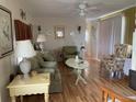 Cozy living room featuring a sofa, chairs, and coffee table at 5560 Holiday Park Blvd, North Port, FL 34287