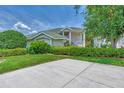 Two-story house with a two-car garage and manicured landscaping at 14080 Willow Glen Ct # 233, Port Charlotte, FL 33953