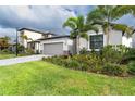 One-story house with attached garage and landscaping at 19536 Fishhawk Trl, Venice, FL 34293