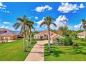 Waterfront property with luxurious home and tropical landscaping at 3031 Rivershore Ln, Port Charlotte, FL 33953