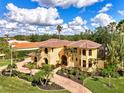 Luxury Mediterranean home with palm trees and a large yard at 3060 Rivershore Ln, Port Charlotte, FL 33953