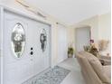 Bright entryway with double doors and a decorative rug at 13515 Keystone Blvd, Port Charlotte, FL 33981