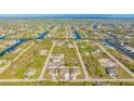Aerial view of a new three-unit home development at 14304 Amestoy Ave, Port Charlotte, FL 33981