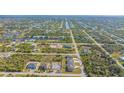 Aerial view showcasing a new three-unit home development at 14304 Amestoy Ave, Port Charlotte, FL 33981