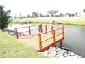 Wooden dock overlooking a canal, perfect for fishing or relaxing at 6113 Partridge Ave, Englewood, FL 34224