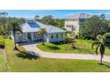 Lovely home exterior with beautiful curb appeal and landscaping at 8025 Weyers Ct, Englewood, FL 34224