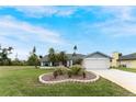 Single-story home with a two-car garage at 10127 Peach Ave, Englewood, FL 34224