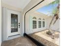 Front entrance with a screened porch and decorative door at 13694 Begonia Cir, Port Charlotte, FL 33981