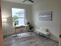 Home office featuring a large window, desk, and comfortable seating at 14331 Montmarte Ave, Port Charlotte, FL 33981