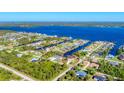 Birds-eye view of the property and surrounding canal-front community at 3016 Montgomery Dr, Port Charlotte, FL 33981