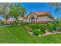 Side view of the house showcasing its landscaping and exterior at 3392 Pennyroyal Rd, Port Charlotte, FL 33953