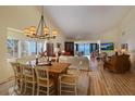 Bright dining room with hardwood floors and ocean view at 5000 Gasparilla Rd # 32B, Boca Grande, FL 33921