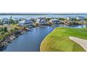 Waterfront homes and golf course with scenic waterway at 10030 Eagle Preserve Dr, Englewood, FL 34224