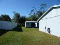 Large backyard with a detached shed and a fenced perimeter at 1325 Eagle St, Port Charlotte, FL 33952