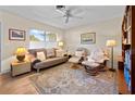 Relaxing living room with comfy seating, a rug, and built-in bookshelves at 445 Stewart St, Englewood, FL 34223