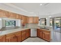 Spacious kitchen with stainless steel appliances and granite countertops at 8508 Gateway Ct, Englewood, FL 34224