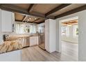 Bright kitchen featuring white cabinets, stainless steel appliances, and butcher block countertops at 1305 Rocky Creek Ln, Englewood, FL 34224