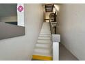 Clean, well-lit interior staircase at 1515 Forrest Nelson Blvd # A 202, Port Charlotte, FL 33952
