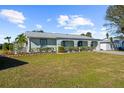 Front view of a charming house with well-maintained landscaping at 2191 Morley St, Port Charlotte, FL 33952