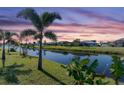 Peaceful canal view with lush vegetation and homes at 256 Mark Twain Ln, Rotonda West, FL 33947