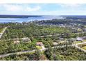 A serene neighborhood is nestled between lush greenery and sparkling waters at 4036 Elvington Rd, Port Charlotte, FL 33981
