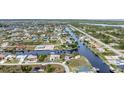 Wide aerial showcasing a waterfront community with many houses and canals at 15500 Longview Rd, Port Charlotte, FL 33981