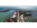 Aerial view showcasing condo location near water, bridge, and other buildings at 1651 Beach Rd # 212, Englewood, FL 34223