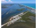 Wide aerial showcasing waterfront community and marina at 1751 Beach Rd # 204, Englewood, FL 34223