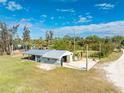 Detached workshop with metal roof and concrete slab at 6341 Biggs St, Englewood, FL 34224