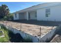 New home features a concrete patio area, ready for your backyard oasis at 7351 Lighthouse St, Englewood, FL 34224