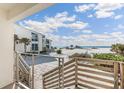 Wooden deck steps leading to the beach at 5000 Gasparilla Rd # 19A, Boca Grande, FL 33921