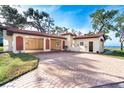 Spacious garage with ample storage space and decorative accents at 99 W Riverview Ave, Englewood, FL 34223