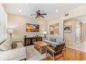 Spacious living area with hardwood floors, neutral decor and access to other rooms at 10300 Coral Landings Ct # 91, Placida, FL 33946