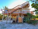 Elevated beach house with multiple decks and outdoor shower at 9526 Jolly Roger Trl, Placida, FL 33946