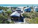 Charming beachfront homes offer scenic views and feature colorful exteriors at 9526 Jolly Roger Trl, Placida, FL 33946