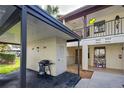 Condo building exterior with covered parking and grill at 524 Pine Hollow Cir # 524, Englewood, FL 34223