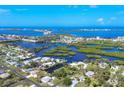 Panoramic aerial view of the coastal community, showcasing waterfront properties and waterways at 1493 Janet Pl, Englewood, FL 34223