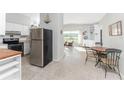 Kitchen boasts stainless steel appliances and opens to a dining area at 1770 Hudson St, Englewood, FL 34223