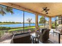 Relaxing screened-in lanai overlooking a peaceful lake at 23536 Awabuki Dr # 4B, Venice, FL 34293