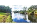 Serene canal view with lush tropical landscape at 328 Baytree Dr, Rotonda West, FL 33947