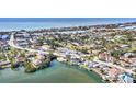 Beautiful aerial view of a waterfront community near the ocean, showcasing lush greenery and residential properties at 710 Albee W Rd, Nokomis, FL 34275